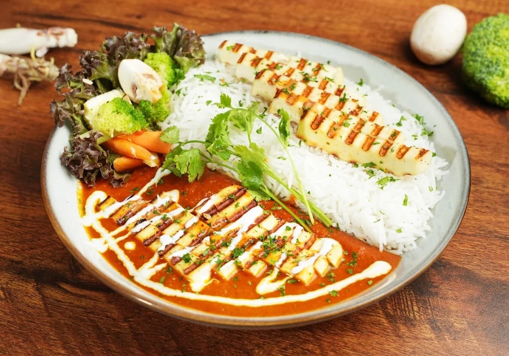 Grilled paneer steak with makhani sauce and rice